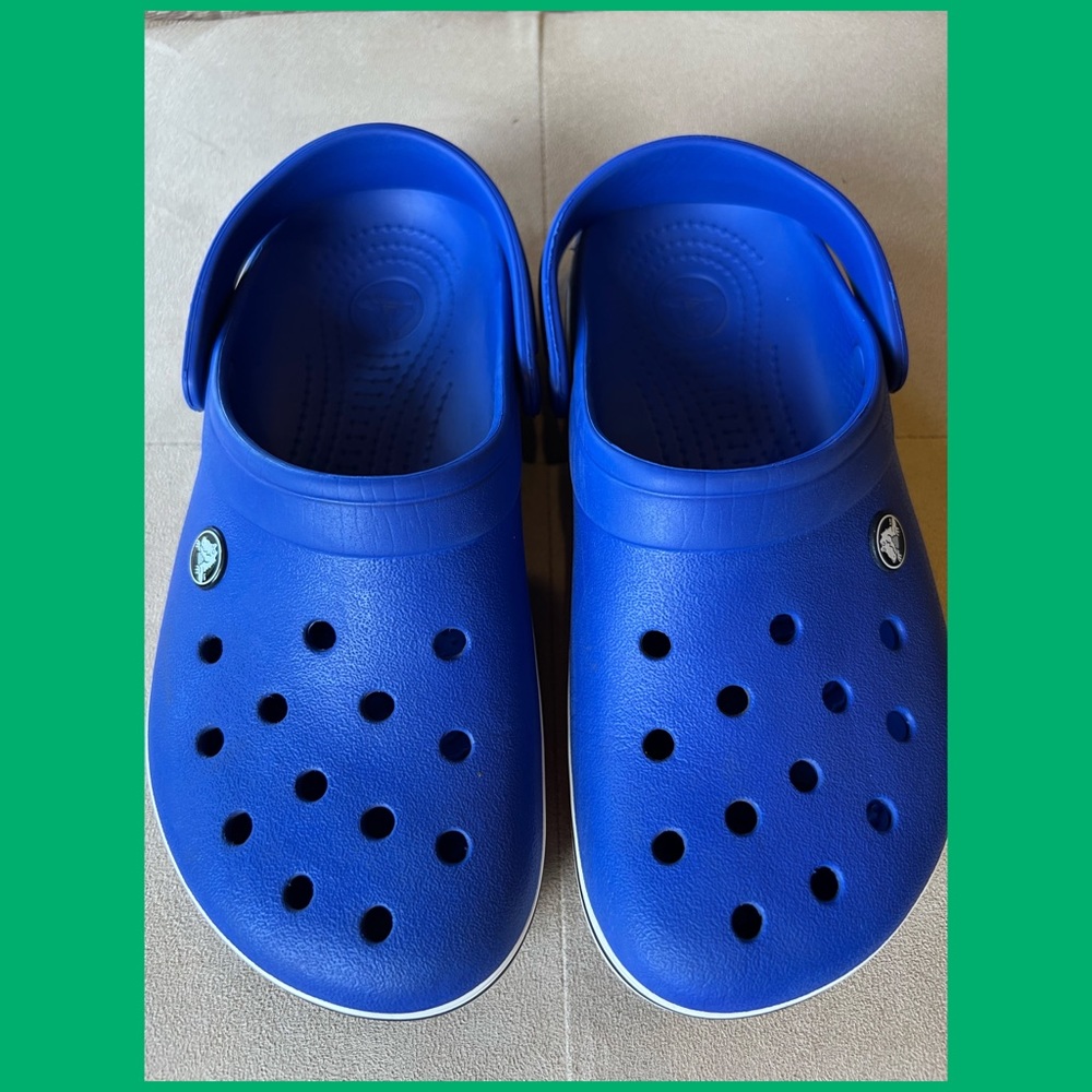 Blue Crocs in Excellent condition . Men size 6 women size 8